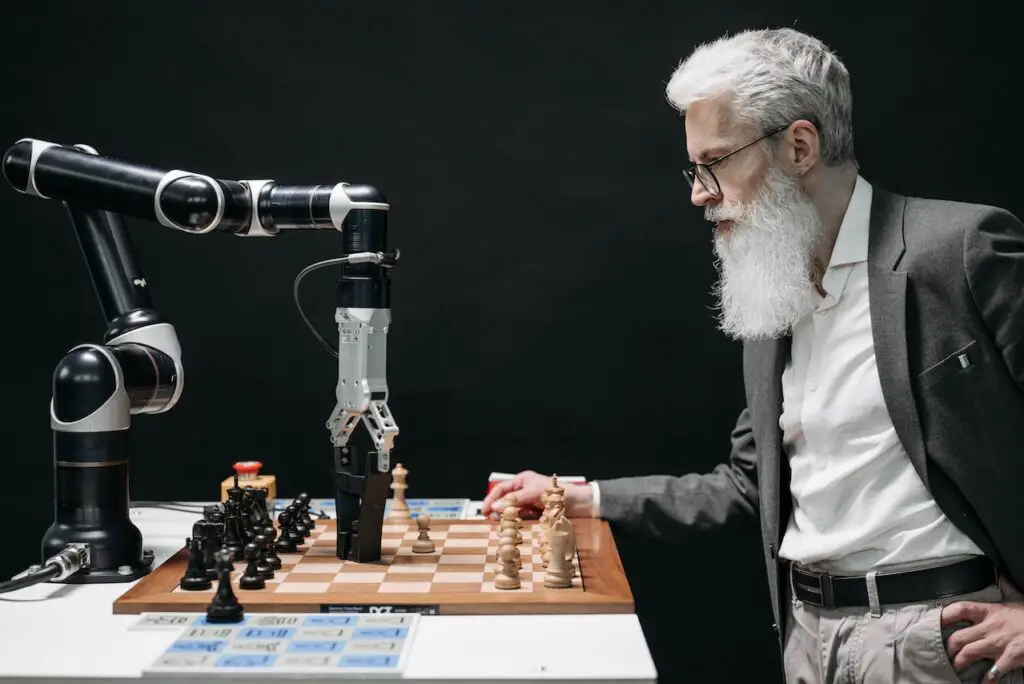 A man playing chess with a robotic arm powered by AI