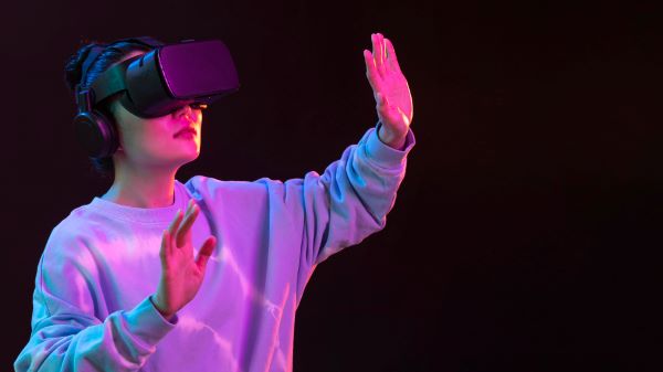 latest advancements in electronics showing a woman wearing an VR headset
